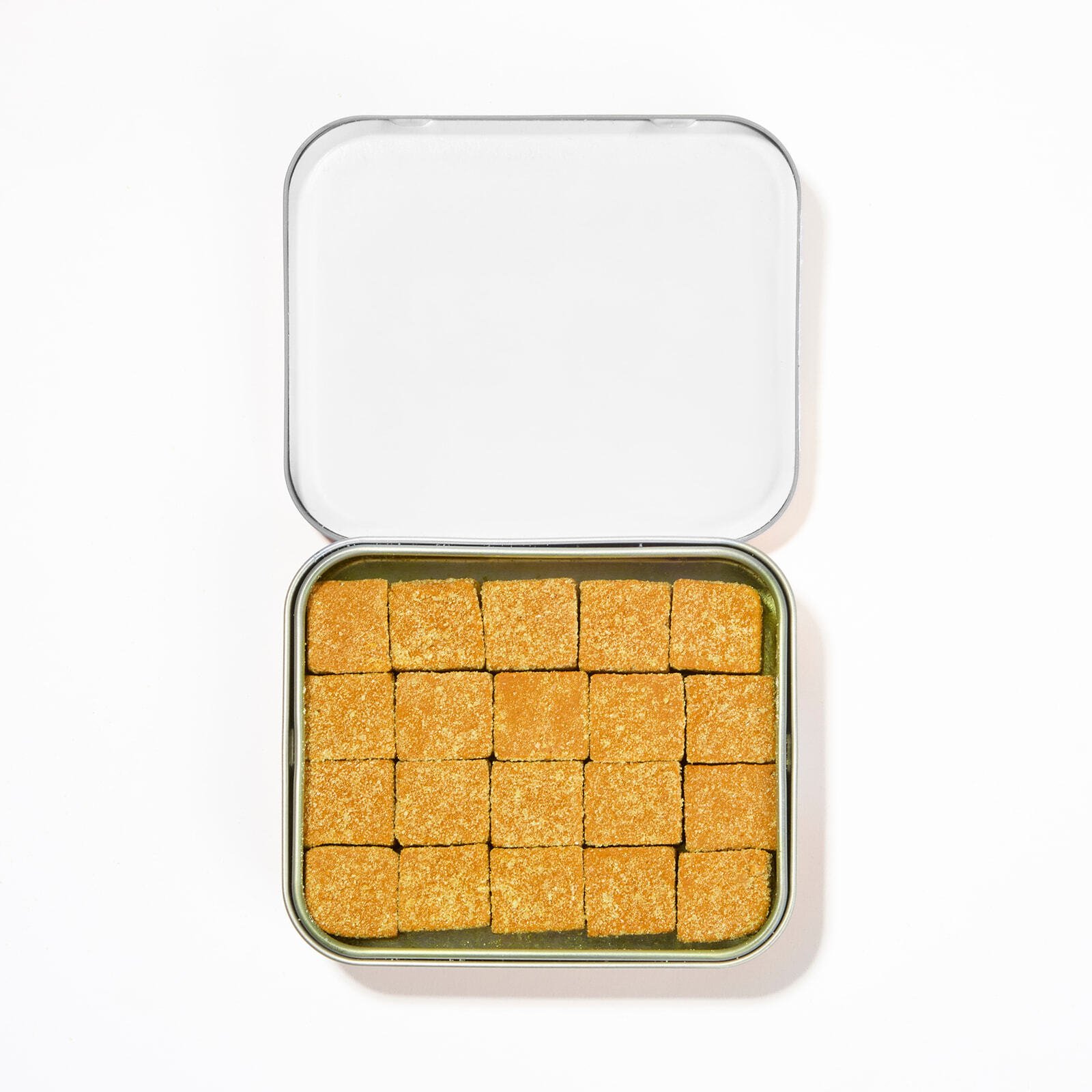 Open tin of Fixer Upper THC gummies